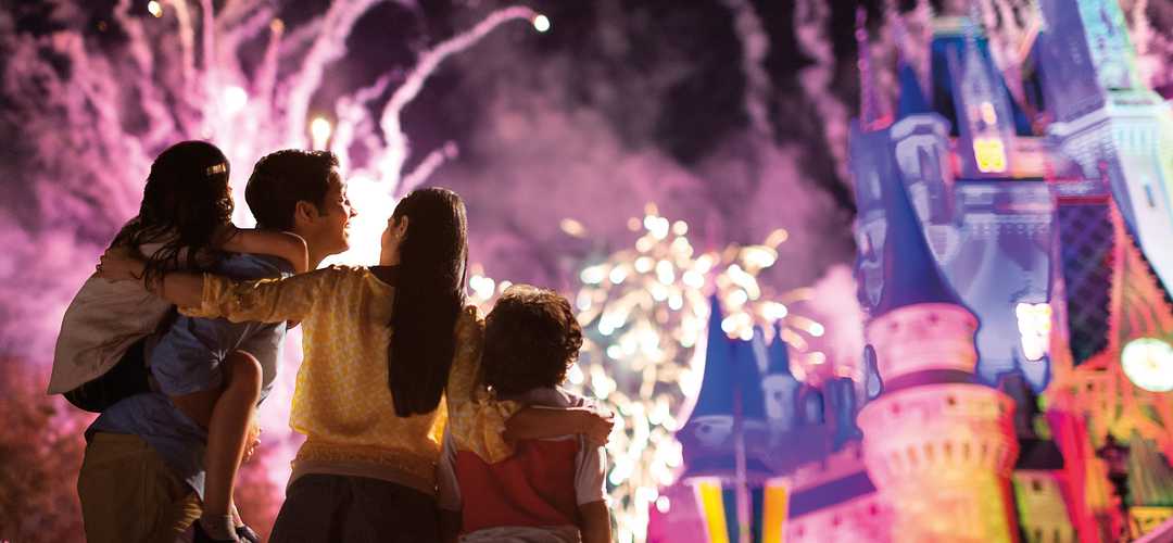 Family Hug and Fireworks at Disney’s Magic Kingdom A close family enjoys the dazzling display of fireworks at Cinderella’s Castle in Disney’s Magic Kingdom.