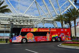 City Sightseeing Orlando tour bus in front of The Wheel at ICON Park