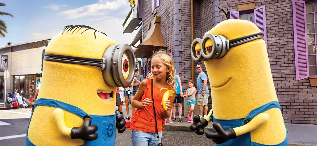 Minions at Universal Studios Florida Three friends posing with two Minions at Universal Studios Florida