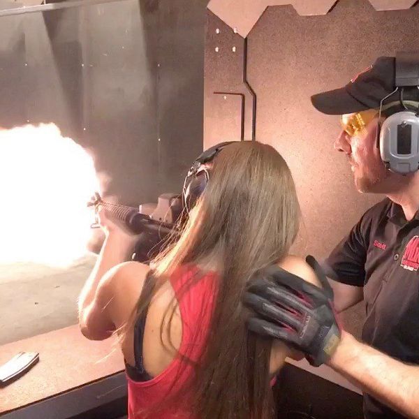 Woman shooting machine gun at Machine Gun America