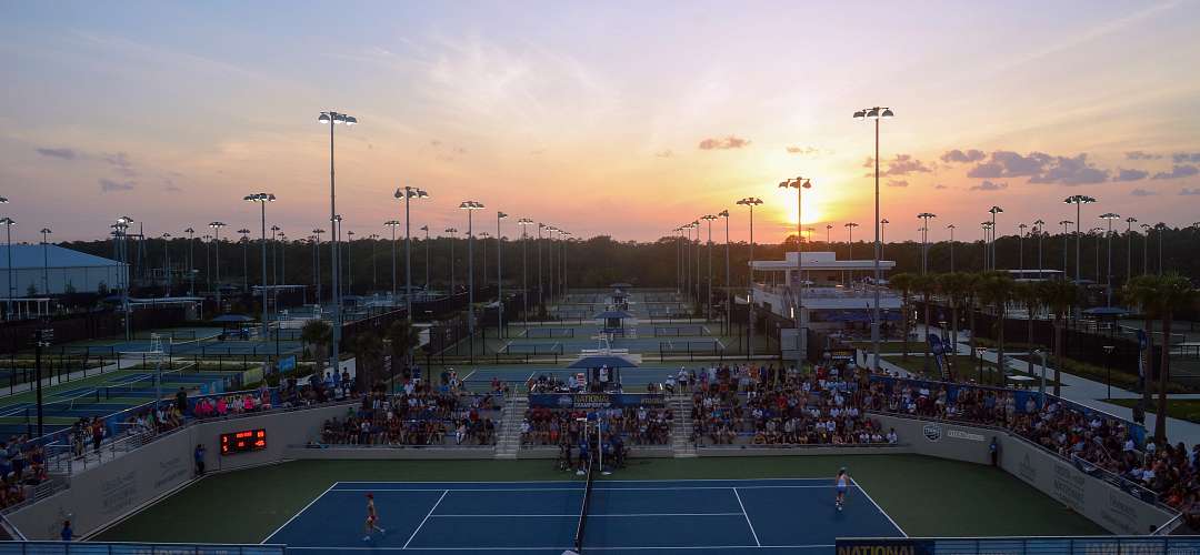 View of the USTA Campus An elevated view of several of the tennis courts at the USTA Campus.