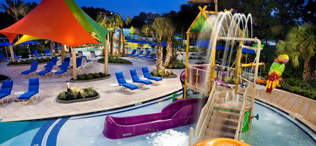 Renaissance Orlando at SeaWorld hotel swimming pool A nighttime view of the splash area and water slides at the Renaissance Orlando hotel pool