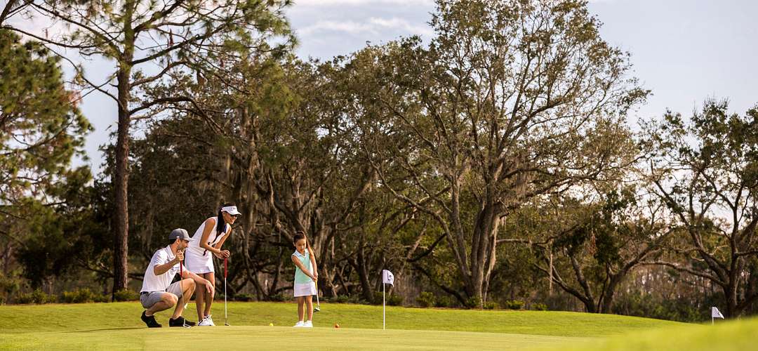 Family playing golf Family playing golf