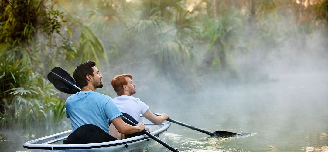 Kayaking in Central Florida A couple of men kayaking through King's Landing at Wekiva River