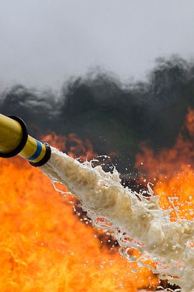 Fire-fighting foam being sprayed on a fire