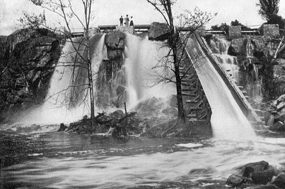 Historic black and white photo of the Prairie River flowing over a dam