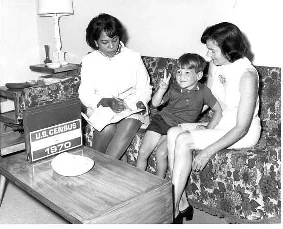 census worker taking information from a mother and son in 1970