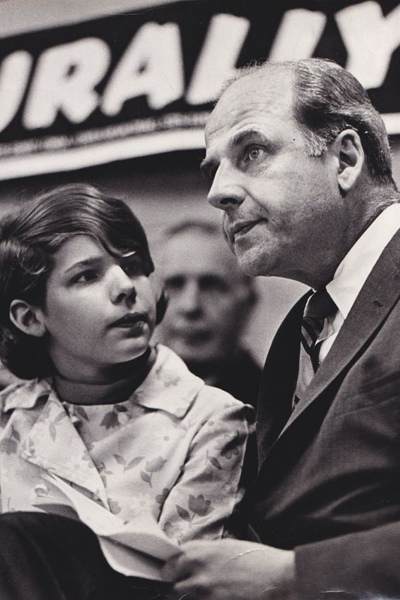 teenage Tia Nelson sits near her father, Sen. Gaylord Nelson, at a rally