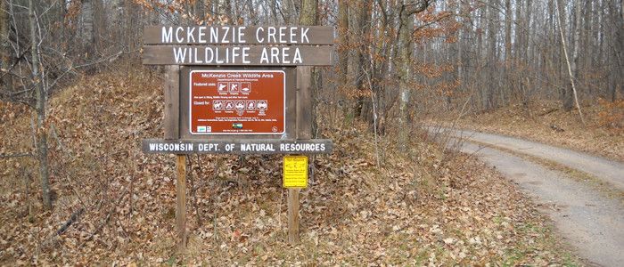 A photo of the entrance and sign for the Mckenzie Creek Wildlife Area