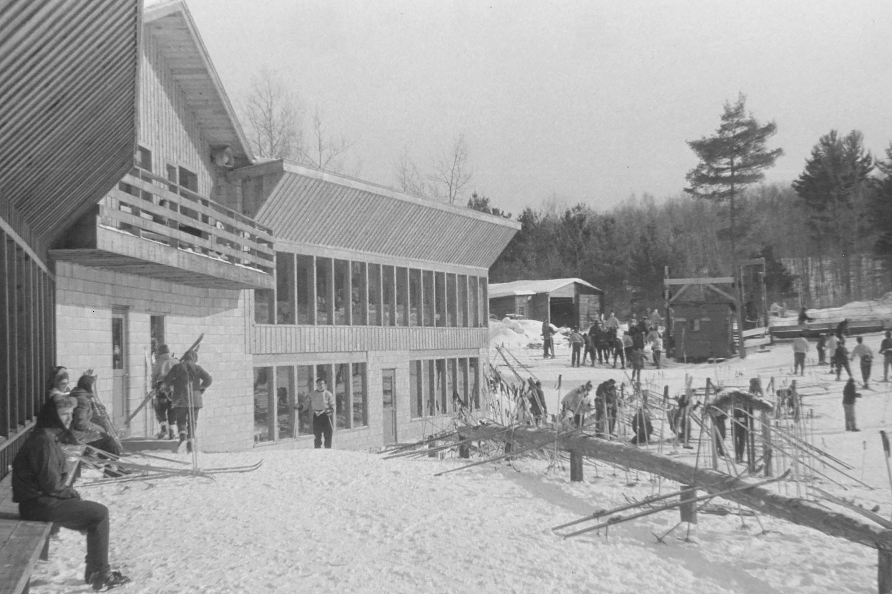 Historic photo of cross-country skiers gathered around Telemark Lodge in Cable, Wisconsin