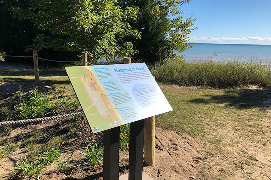 An interpretive sign at a rain garden at Point Beach State Forest