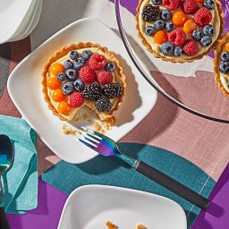 Pure White Square dinner plates with food on them 