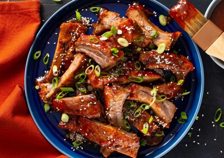 Baby Back Ribs in a bowl with sauce