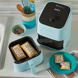 Instant™ Vortex™ Mini 2-quart Aqua Air Fryer on the counter with food - top view