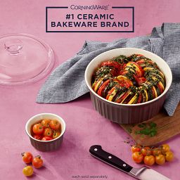 French Colors 1.5-quart Round Baking Dish, Cabernet with food inside and text on image #1 ceramic bakeware brand