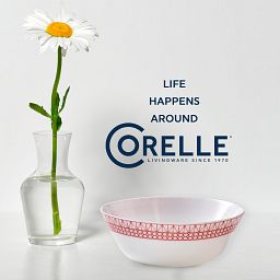 Graphic Stitch 18-ounce Cereal Bowl on table with vase with text Life Happens around Corelle