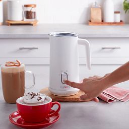 Instant White Milk Frother on counter with coffee & hot chocolate