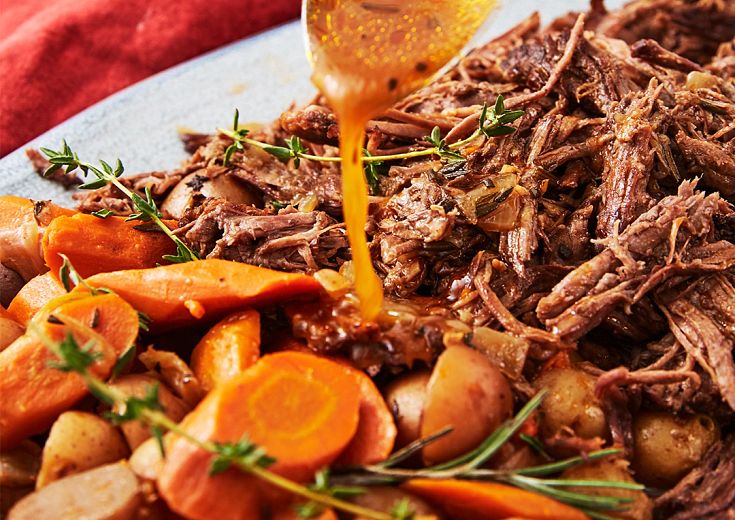 Pot Roast with gravy and carrots on a plate