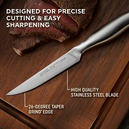 Insignia Steel Steak Knife Set on plate with text contoured stainless steel handle fits comfortably in hand