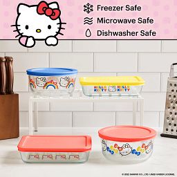 8-piece Glass Storage Set: Hello Kitty® Rainbows & Bows on counter with food Pyrex and Hello Kitty logos on the top