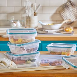 Total Solution™ 10-piece Rectangular Plastic Food Storage Set on counter with food
