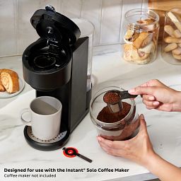 Instant™ Solo Reusable Coffee Pod with Handle, Compatible with Instant Solo Coffee Maker being used to put coffee in coffee make
