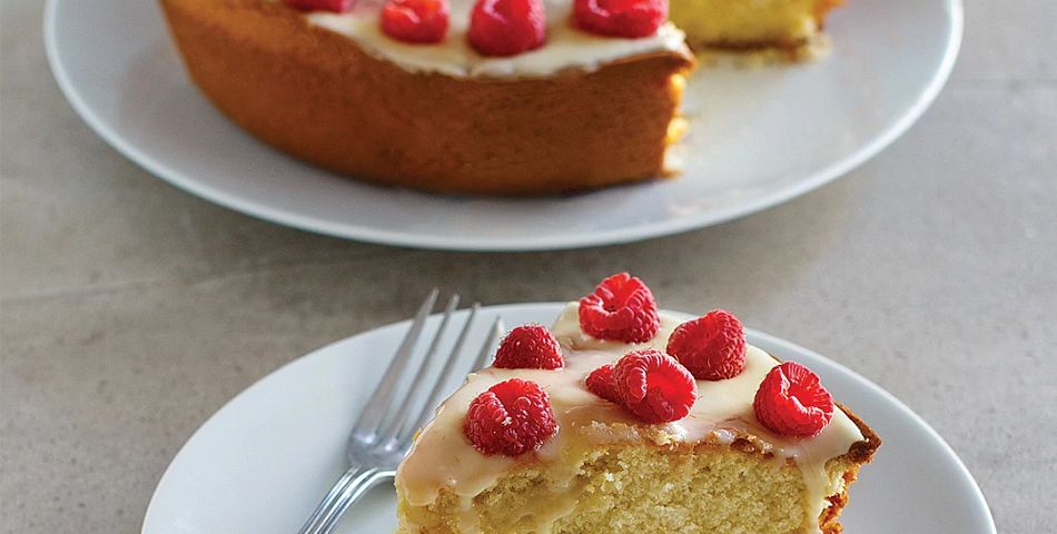 Raspberry Cake with Lemon Glaze with a slice cut to be served
